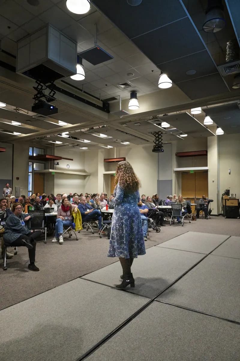 A speaker addressing a full room of District 3 Toastmasters members at the 2026 Toastmasters Leadership Institute in Phoenix