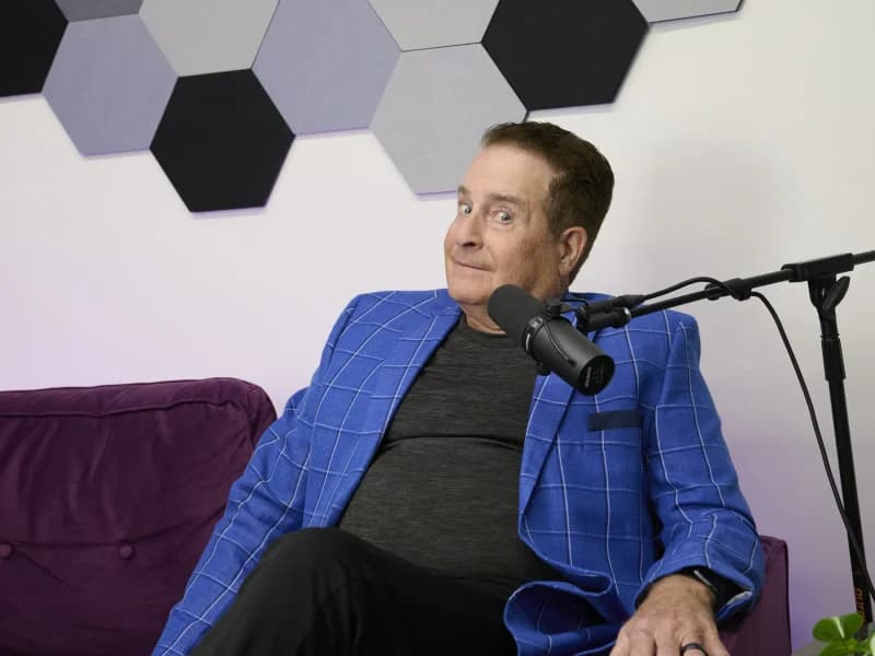 Paul Pastore in a blue plaid blazer at the Speak Arizona podcast studio